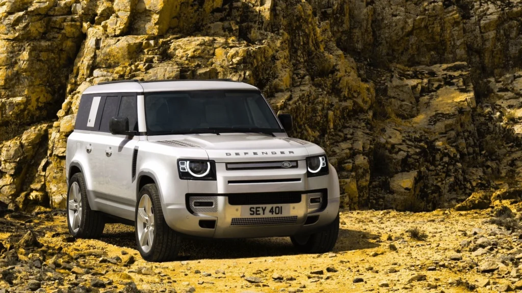 2024 Land Rover Defender off-road driving through rocky terrain
